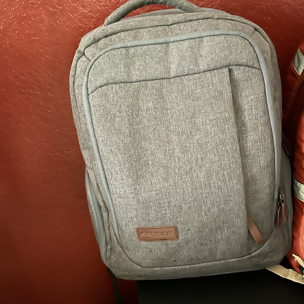 Grey backpack with multiple pockets